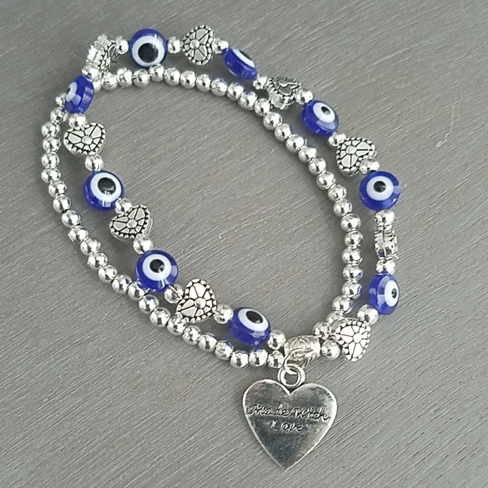 Blue eyes and silver heart bracelet